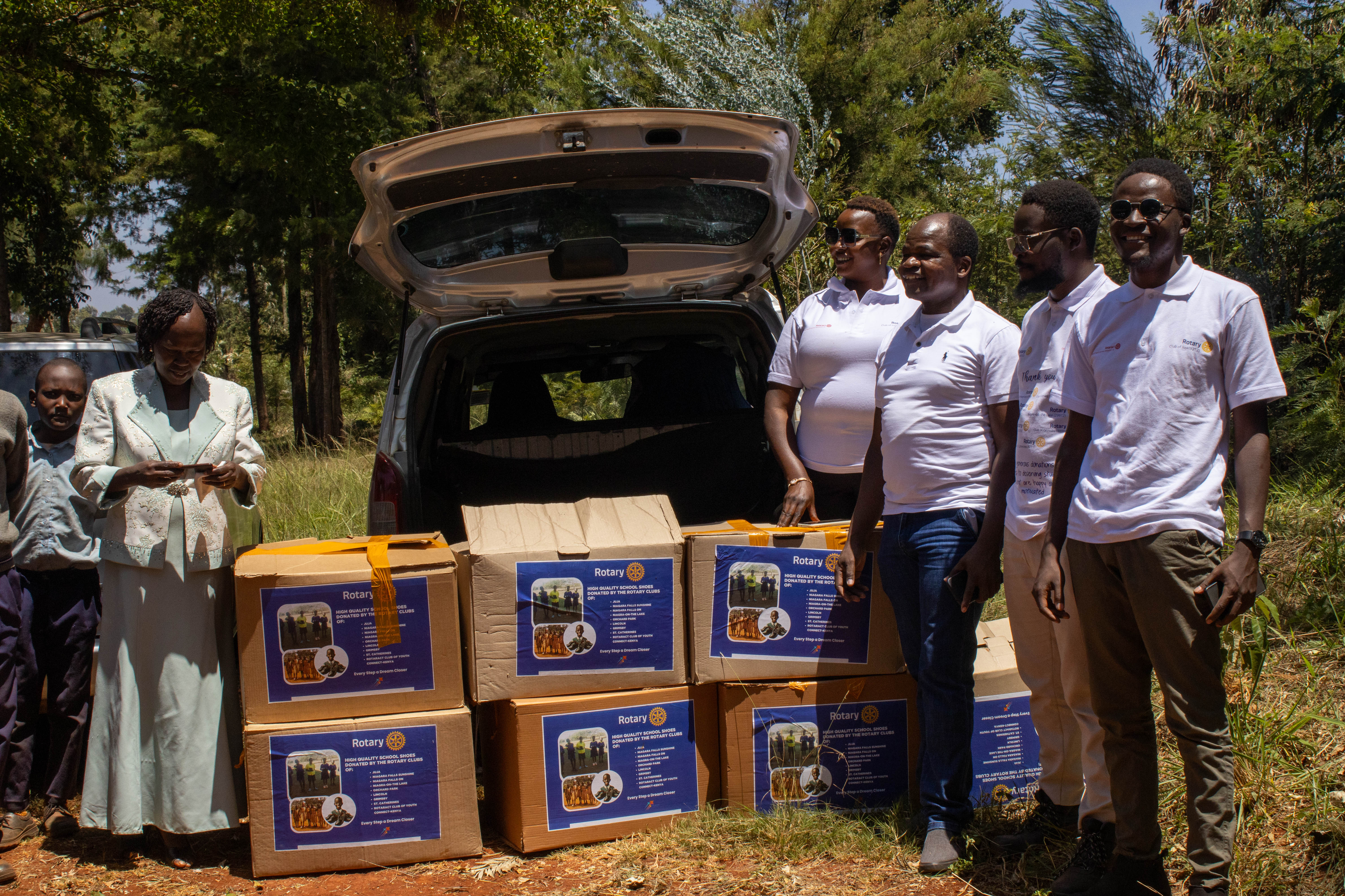 Rotary Club of Juja volunteers preparing a school shoe donation